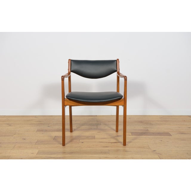 The armchair made of teak wood in Denmark in the 1960s. An armchair with an interesting form, characterized by profiled...