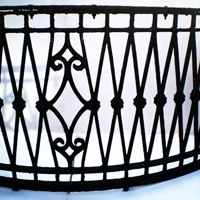 Antique early 20th century demilune form balcony front having gathered lozenge design with central cartouche.• Fifteen...