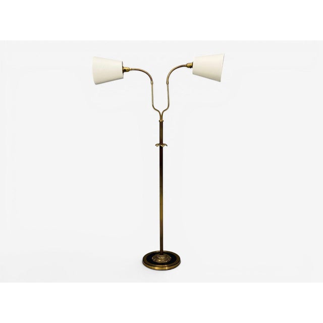 Swedish Mid-Century Modern, Two Head Floor Lamp, Reeded Brass, Sweden, 1950s A gooseneck standing lamp in brass and metal...