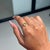 This Art Deco-inspired ring showcases a 0.77 carat natural yellow sapphire, set in 14k yellow gold. The center stone...