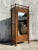 This vintage boho carved bamboo armoire combines intricate craftsmanship with natural materials, offering both style and...