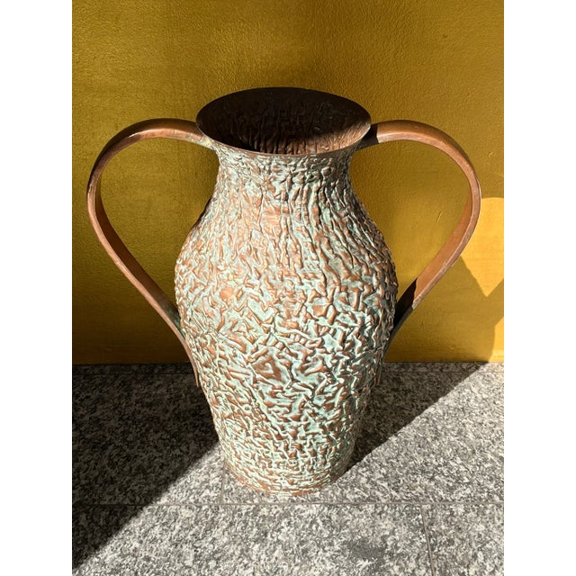 This impressive copper vessel from the 1960s combines rustic charm with timeless design. The natural patina gives it an...