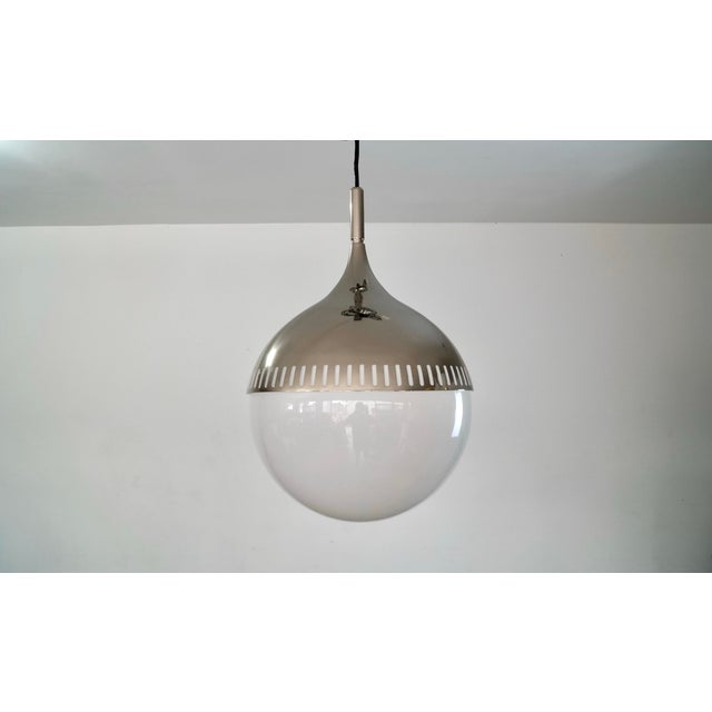 Original Jonathan Adler Rio pendant ceiling lamp for sale. Brand new, and never used. Has a polished nickel teardrop shape...