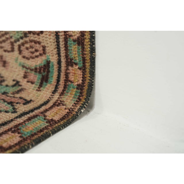 This vintage hand-knotted area rug is a semi-antique vintage area rug. The '70s Eastern Anatolian region's unique rug is...