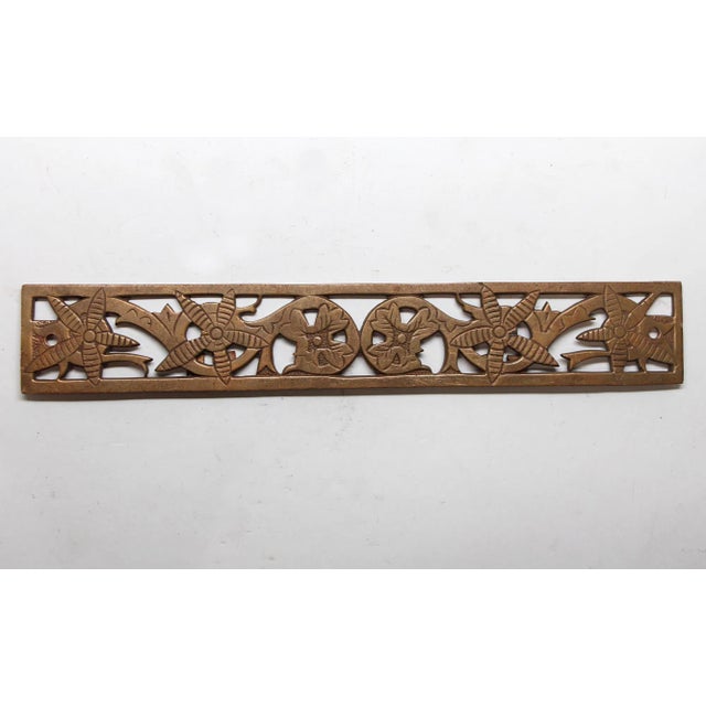 Brass cut out style decorative hardware piece with floral details. The original mounting screws are not available. The...