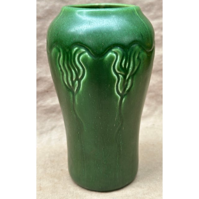 Here we have a arts & crafts period matte green Hampshire vase with flowing floral design from top to bottom , very good...