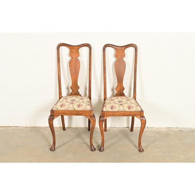 A gorgeous set of four Queen Anne or Georgian style side chairs or dining chairs In the manner of Baker Furniture USA,...