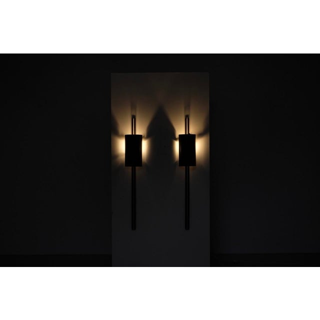 Pair of "Monza" wall sconces in patinated metal. Designed by Franck Robichez and signed for Dritsh, Paris, 1990s. Designer...