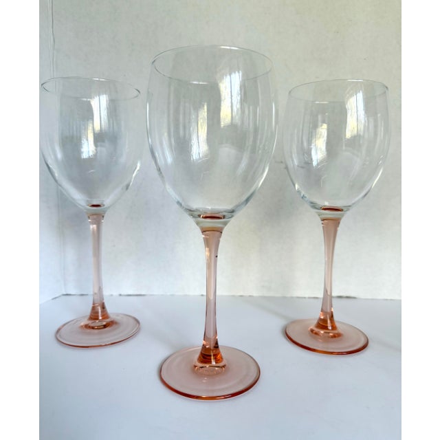 Here is a lovely set of 5 pink stemmed wine glasses made by Luminarc in France, in the mid-century. They have a beautiful...