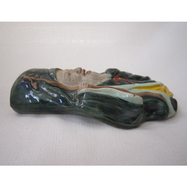 Charming Immortal Pottery Wall Pocket. It measures 7.5"H x 4"W x 1"D and is in excellent condition.