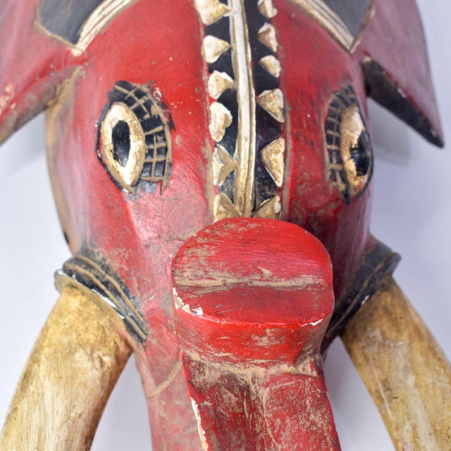 An elephant mask with features indicating a Baule style. This well-carved example would have been worn during performances...