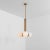 Tubular md brass pendant light by schwung dimensions: w 49 x d 49 x h 88 cm materials: brass, frosted glass finishes...