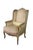 This classic Louis XVI style wingback bergère is crafted from solid walnut, showcasing a beautifully carved exposed wooden...