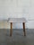 Vintage Danish Mid Century Modern vanity stool featuring solid teak tapered legs and a softly curved upholstered seat....