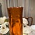 This tall mid-century AmberGenie bottle glass vase. It is so elegant for its vibrant, color and shape, sleek design that...