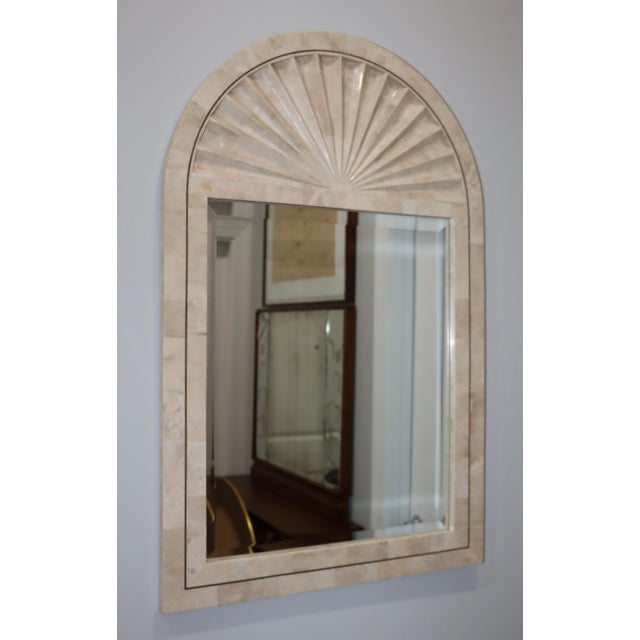 1990's mid-century modern arched tesselatted stone wall mirror with brass detail in the style of Maitland Smith, in...