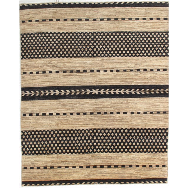 Vintage hand-knotted Gabbeh rug with a striped design featuring alternating bands of geometric motifs and textured fields....