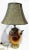 A unique table lamp made from a hand-hammered copper and brass olive oil urn. Newly wired w/ fabric cord in working...