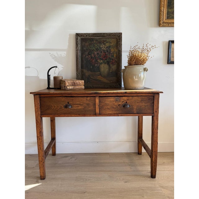 A quietly handsome 19th-century table or small desk with a straightforward, workmanlike form that leans distinctly English...