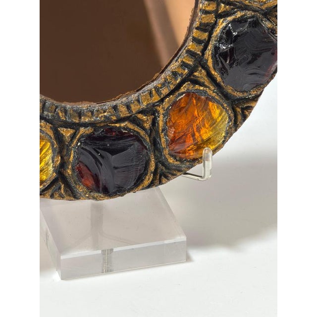 Brutalist Murano glass mirror by Creaciones Gobesso, dated 1983, with a sculptural gilt gesso frame set with amber and...