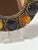 Brutalist Murano glass mirror by Creaciones Gobesso, dated 1983, with a sculptural gilt gesso frame set with amber and...