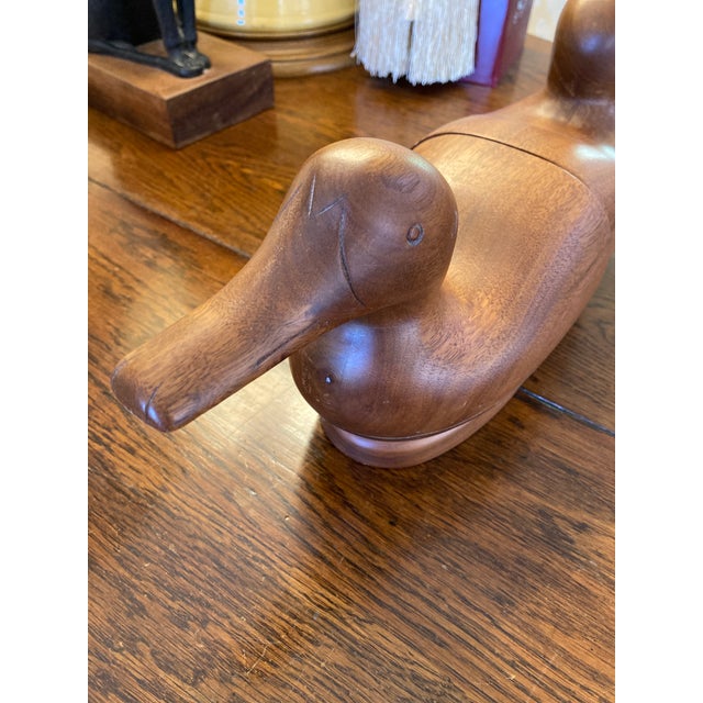 Vintage hardwood duck bookends with green felt bottoms. Nice and heavy and signed by the artist. Golden maple deep tan color.