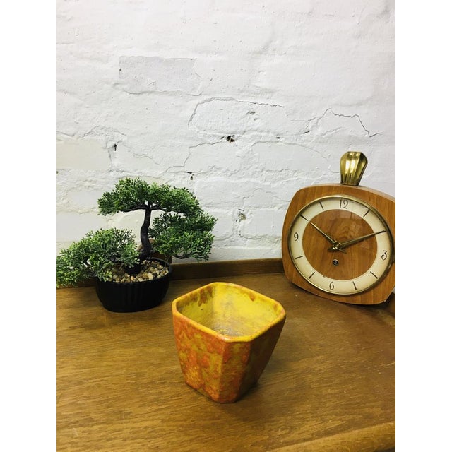 Ceramic flower pot designed and created by the ceramic artist János Kornfeld. The side is decorated with orange shrink...