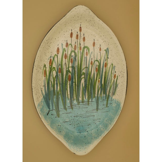 A harmonious pair of mid-century studio pottery platters by Jobi Studio Pottery, produced on Cape Cod and signed to the...