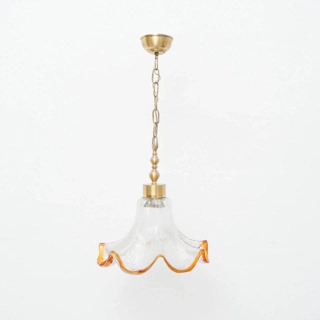 Mid-Century Modern glass pendant lamp, circa 1960. Traditionally manufactured in France. By unknown designer. In original...