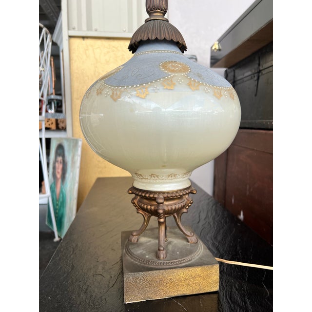 Elevate your space with a touch of mid-century glamour. This striking mid century table lamp beautifully captures the...