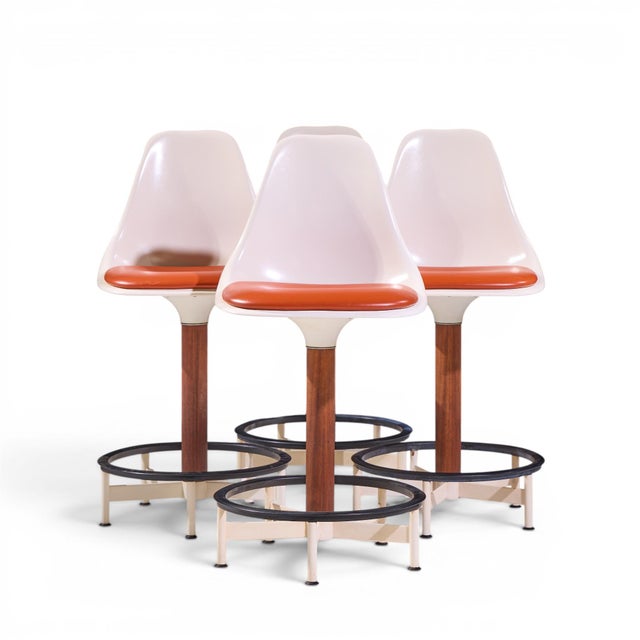 Eero Saarinen Style Burke Mid Century Walnut and Fiberglass Barstools - Set of 4 Each barstool measures: 19 wide x 20 deep...