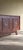Lovely vintage wooden sideboard with great patine. 3 opening doors with carved elephants and lots of storage space inside....