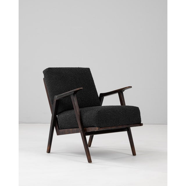 20th century Czech upholstered armchair showcasing the clean lines and geometric precision characteristic of mid-century...