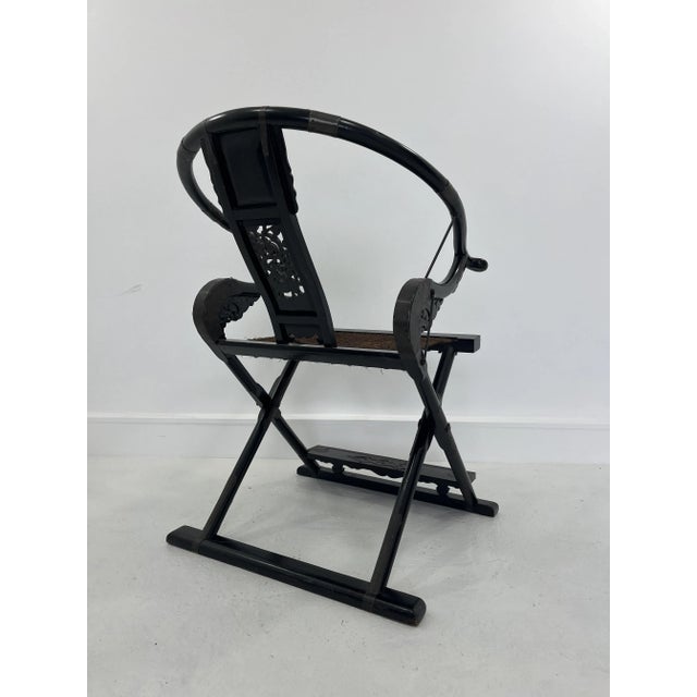 Seat reproduction model Ming Dynasty in elm wood and brass-plated metal. Folding seat. Carved by hand.