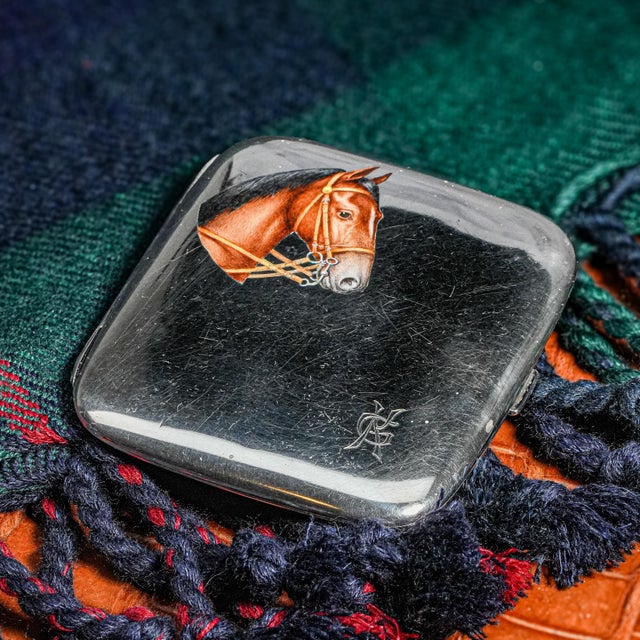 Step into the refined luxury of a bygone age with this extraordinary solid silver antique cigarette case — a striking...