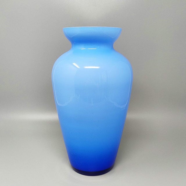 1960s Astonishing blue jacketed vase in Murano Glass. Made in Italy . The item is in excellent condition. Dimension: diam...