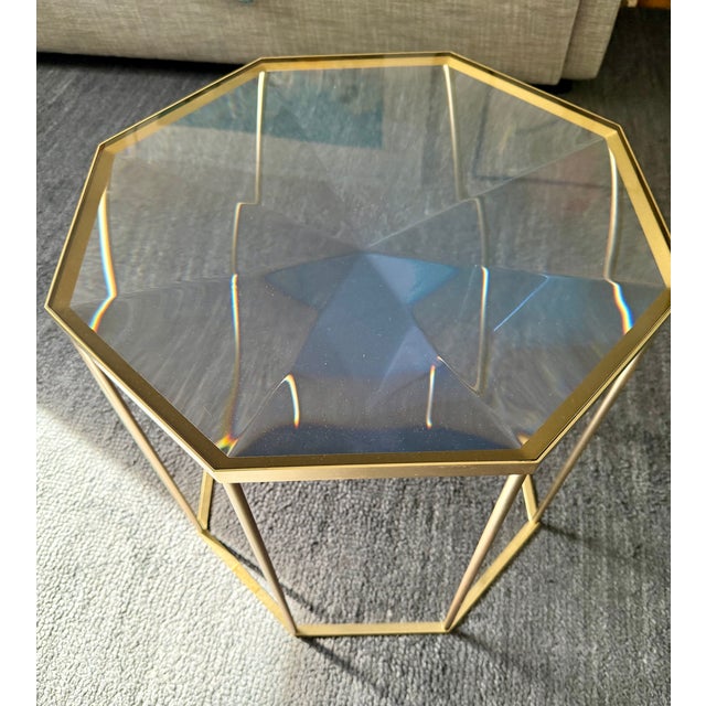 This Tallis side table is hand cast in a tinted resin color of Duck Egg Blue and has reflective qualities that are...