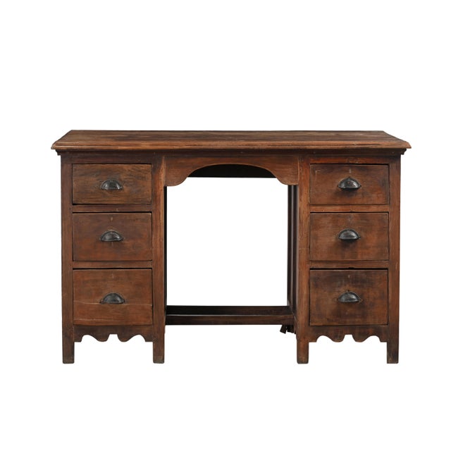 This Vintage Teakwood Six-Drawer Pedestal Desk is a timeless piece crafted from solid teakwood, featuring six spacious...