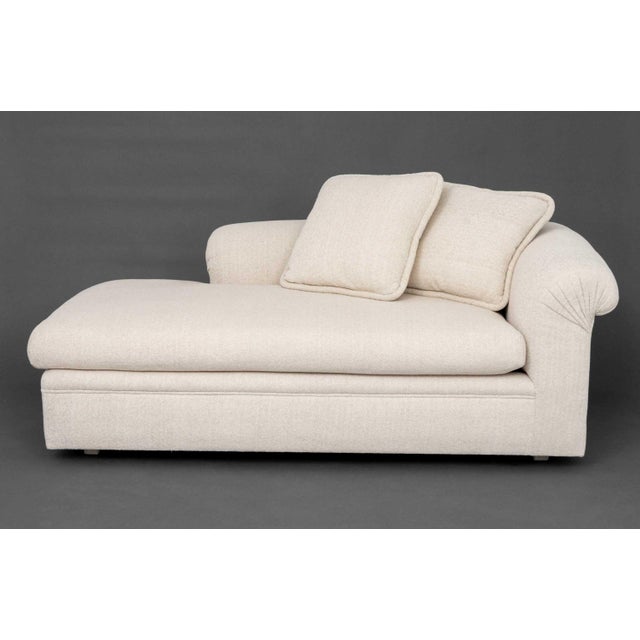 Modern Beige Textured Fabric Upholstered Chaise Longue, together with two matching pillows. 28" H x 77" W x 39" D; seat:...