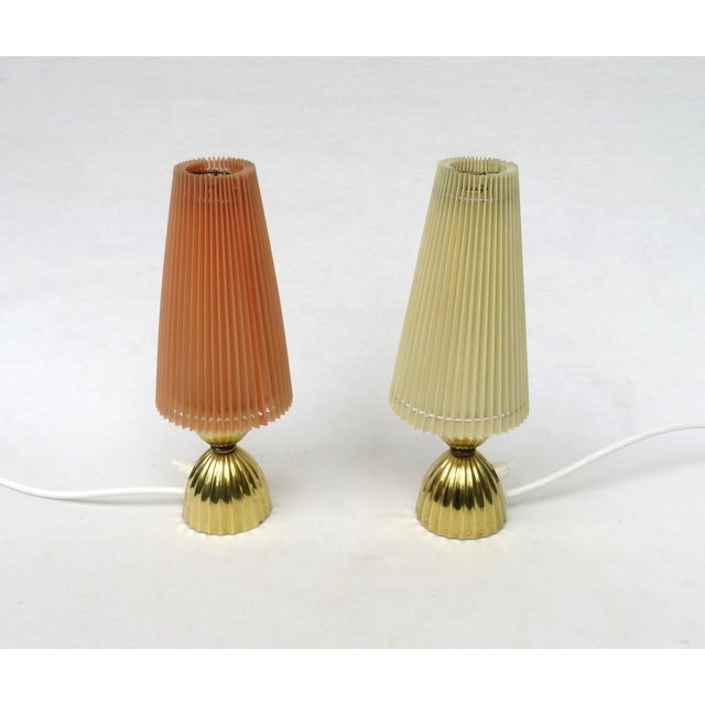 A pair of delicate, elegant table lamps, made in Austria in the 1940s. The lamps are of high-quality craftsmanship. The...
