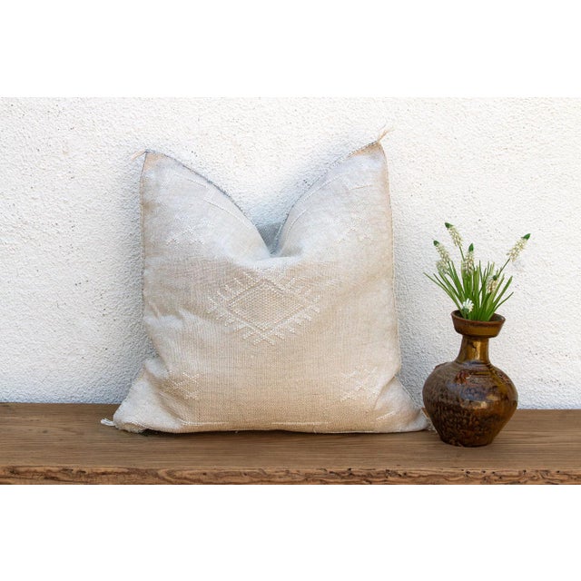 Indulge in the quiet beauty of this handcrafted Moroccan cactus silk pillow, measuring a generous 24 inches square. Woven...