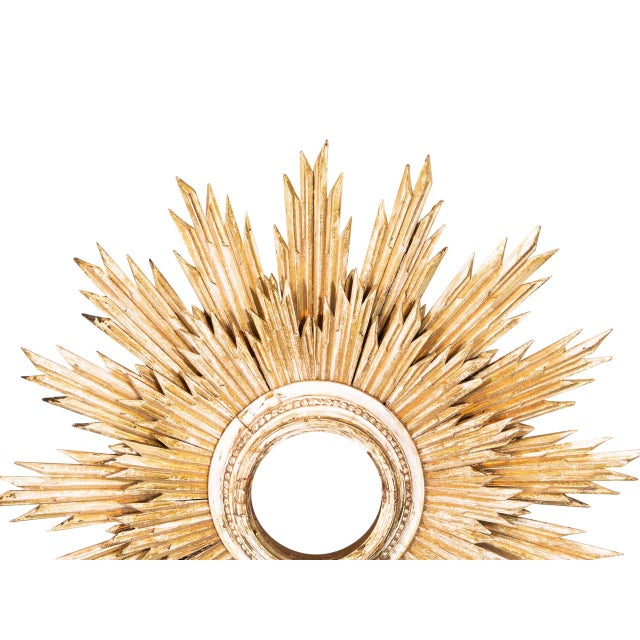 Neoclassical hand-carved giltwood sunburst frame.. Double frame.