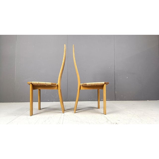 Elegant oak and wicker mid century high back dining chairs. Beautiful sleek design. Very good condition Made in Germany...