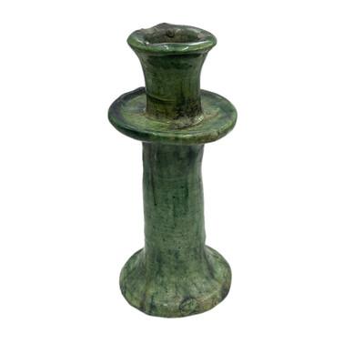A Moroccan Tamegroute glazed candlestick holder is a handcrafted piece made in the historic pottery village of Tamegroute...