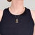 A fine vintage gold & enamel pendant for necklace. In 14 karat yellow gold. In the form of a ladybug surrounded by gold...