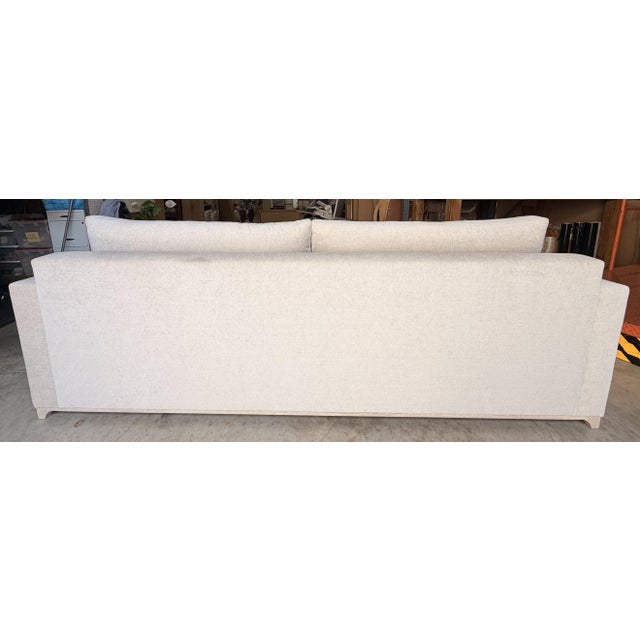 This elegant transitional sofa blends clean contemporary lines with refined designer details. Upholstered in a soft beige...