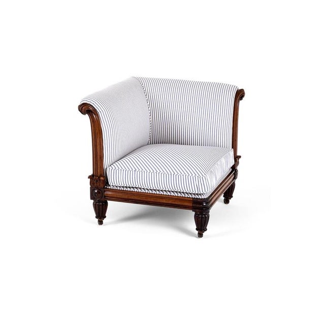 An unusual Victorian mahogany corner chair with a deep square seat and a wide sweeping back rest. The beautifully carved...