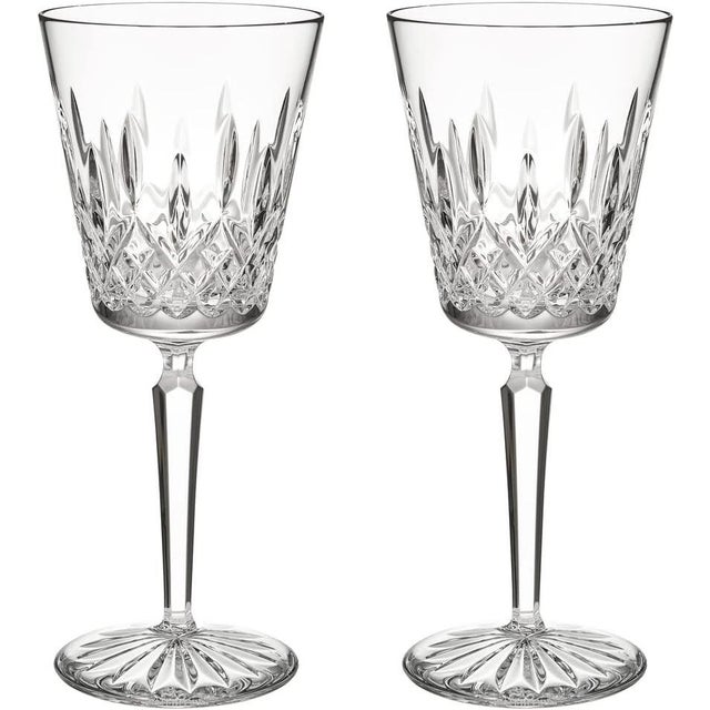 Set of four Waterford Crystal Lismore wine glasses with elegant tall stems and the iconic diamond and wedge cut pattern....