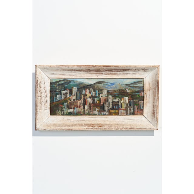 This mid-century oil painting, titled “Hill Town”, captures a layered cityscape nestled among rolling hills. Painted in...