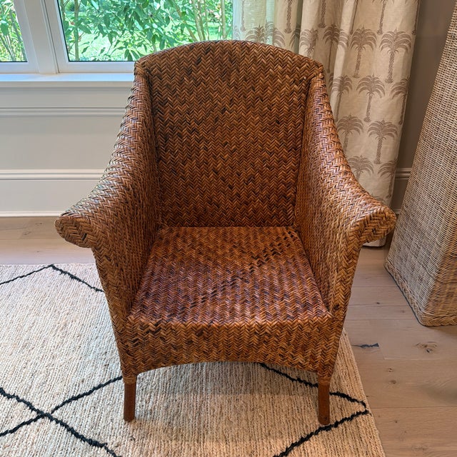 Beautiful vintage Philippine rattan lounge chair featuring an exceptionally intricate herringbone weave, a wonderfully...